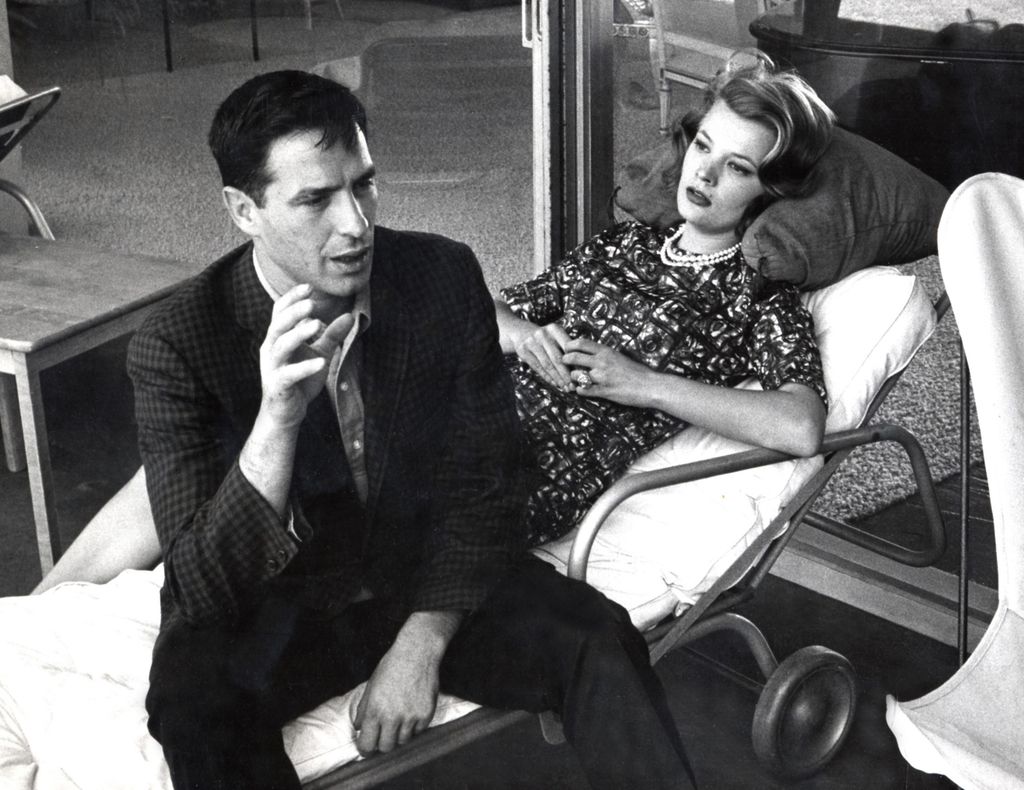 Actor John Cassavetes and actress Gena Rowlands talking at their house in 1964, at Los Angeles, California