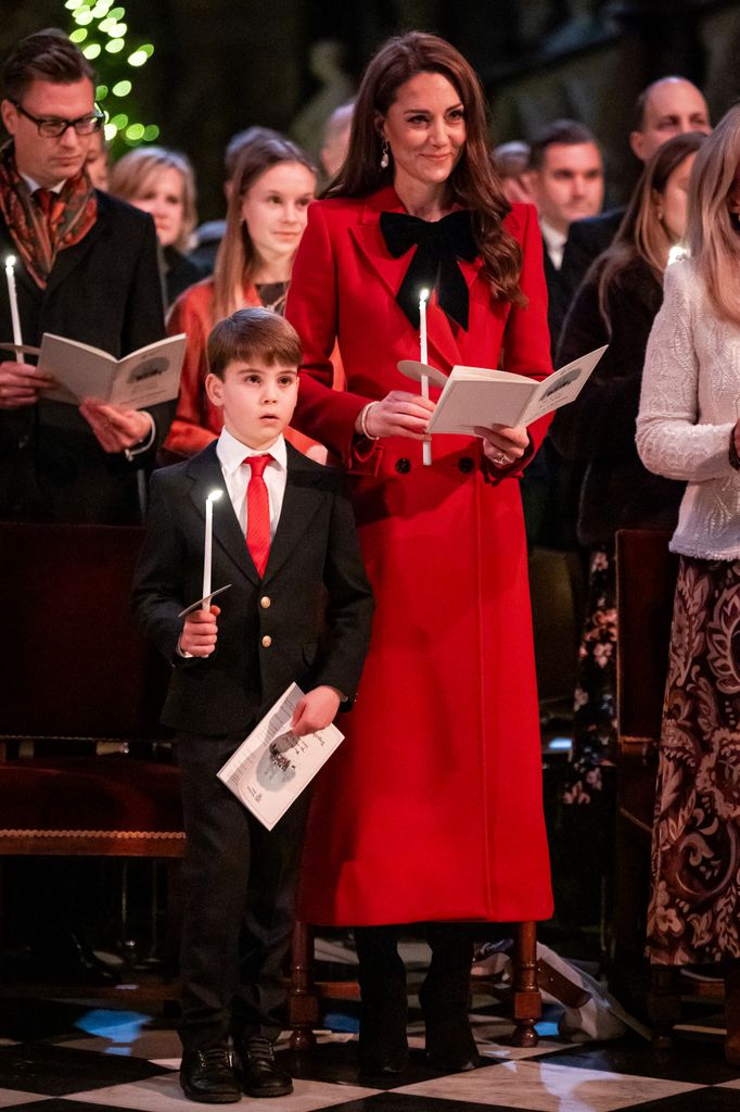 Prince Louis and Kate Middleton hold candles