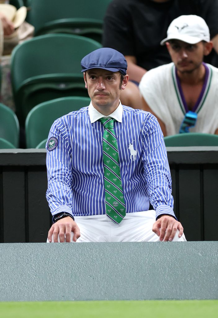 A line judge watching a game of tennis