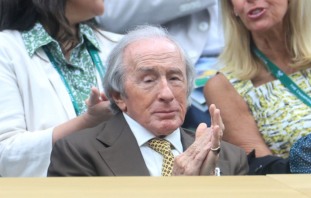 Jackie Stewart clapping in royal box