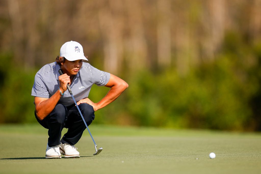 Charlie Woods, son of Tiger Woods, looks over a putt on the 10th hole during the first round of the PNC Championship at Ritz-Carlton Golf Club on December 21, 2024 in Orlando, Florida