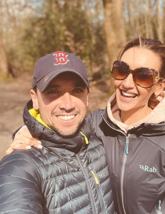 Tom Pitfield and Catherine Tyldesley walking in a forest
