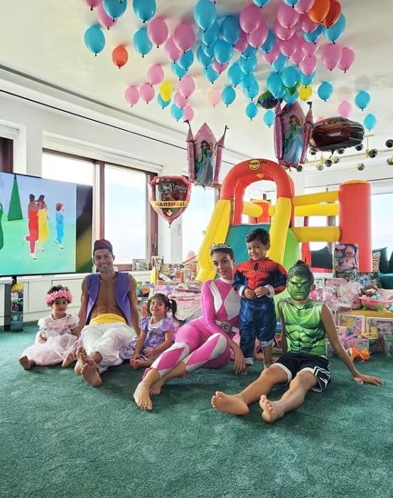 cristiano ronaldo in genie costume alongside family in playroom