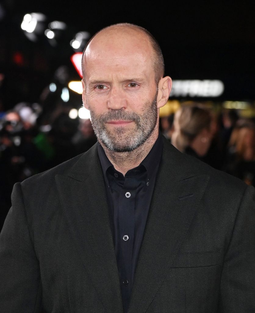 Jason Statham in a black outfit