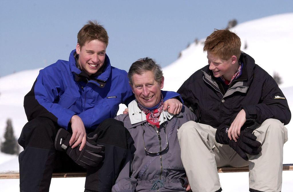 Charles looks happy as he joins the slopes with Harry and William
