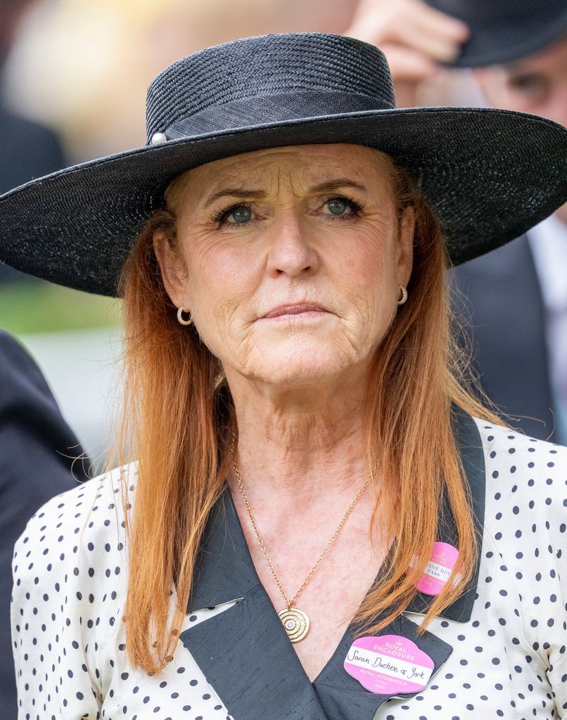 Sarah Ferguson in a polka dot dress and hat looking sad