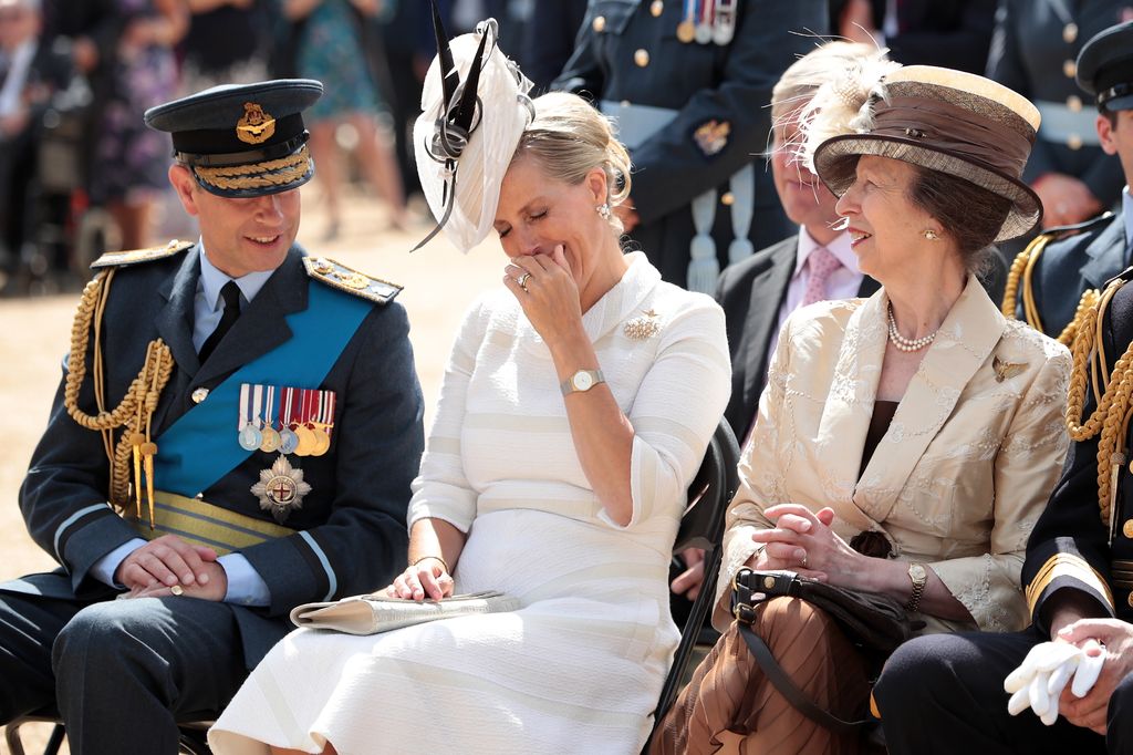 trio of people at RAF ceremony 