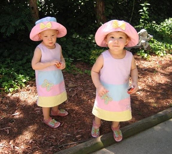 Isabella and Sophia Strahan as toddlers in matching dresses