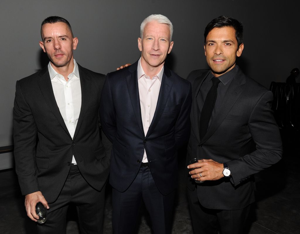 Benjamin Maisani, Anderson Cooper and Mark Consuelos attend Madonna and Steven Klein secretprojectrevolution at the Gagosian Gallery on September 24, 2013 in New York City