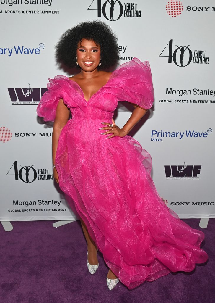 Jennifer Hudson hand on hip in big pink dress
