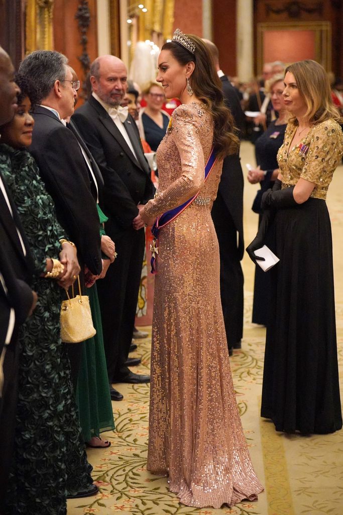 Kate Middleton in sequin dress chatting with guests at diplomatic reception