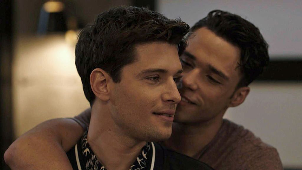 Ronen Rubinstein and Rafael Silva cuddle in the Riddle of the Sphynx episode of 9-1-1: LONE STAR 