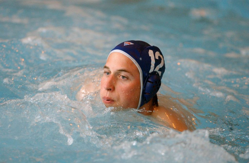 Prince William in a swimming cap playing water polo