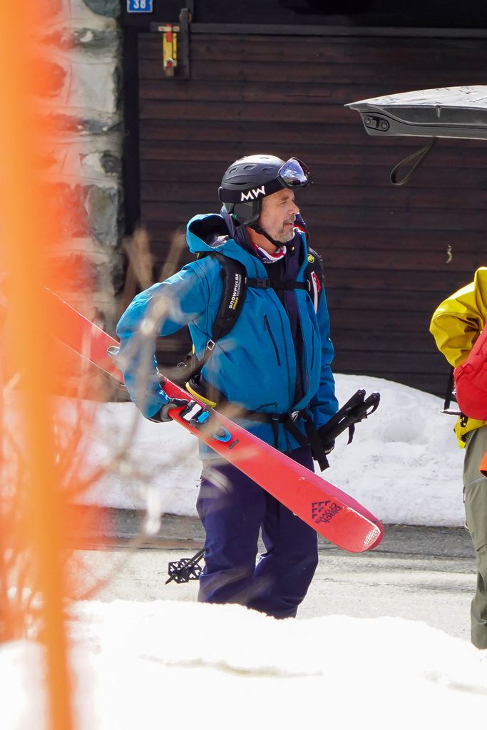 King Frederik holding skiis