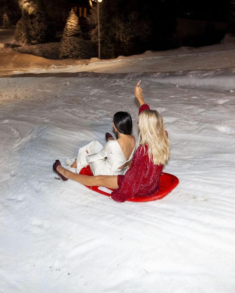 Paris and Kim sledding