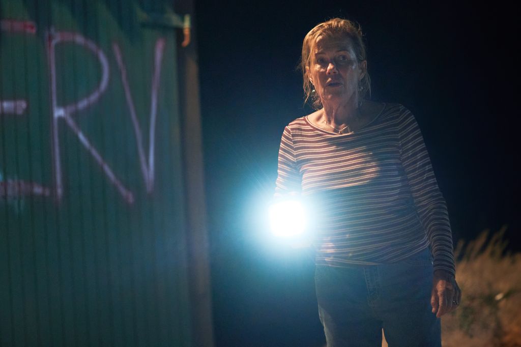 woman holding torch in dark night