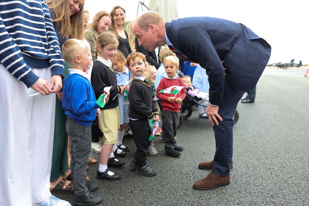 Prince William talks to members of the public during an official visit at RAF Valley