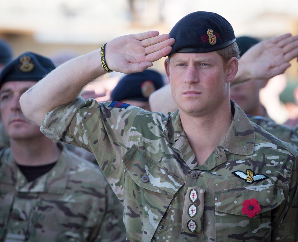 Prince Harry saluting in military uniform