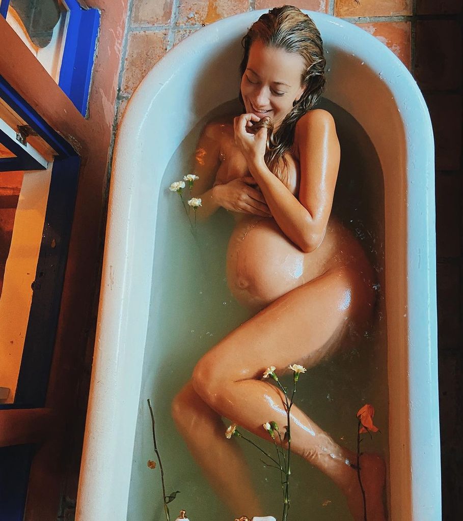 Meredith Hagner lies curled up in a bath 