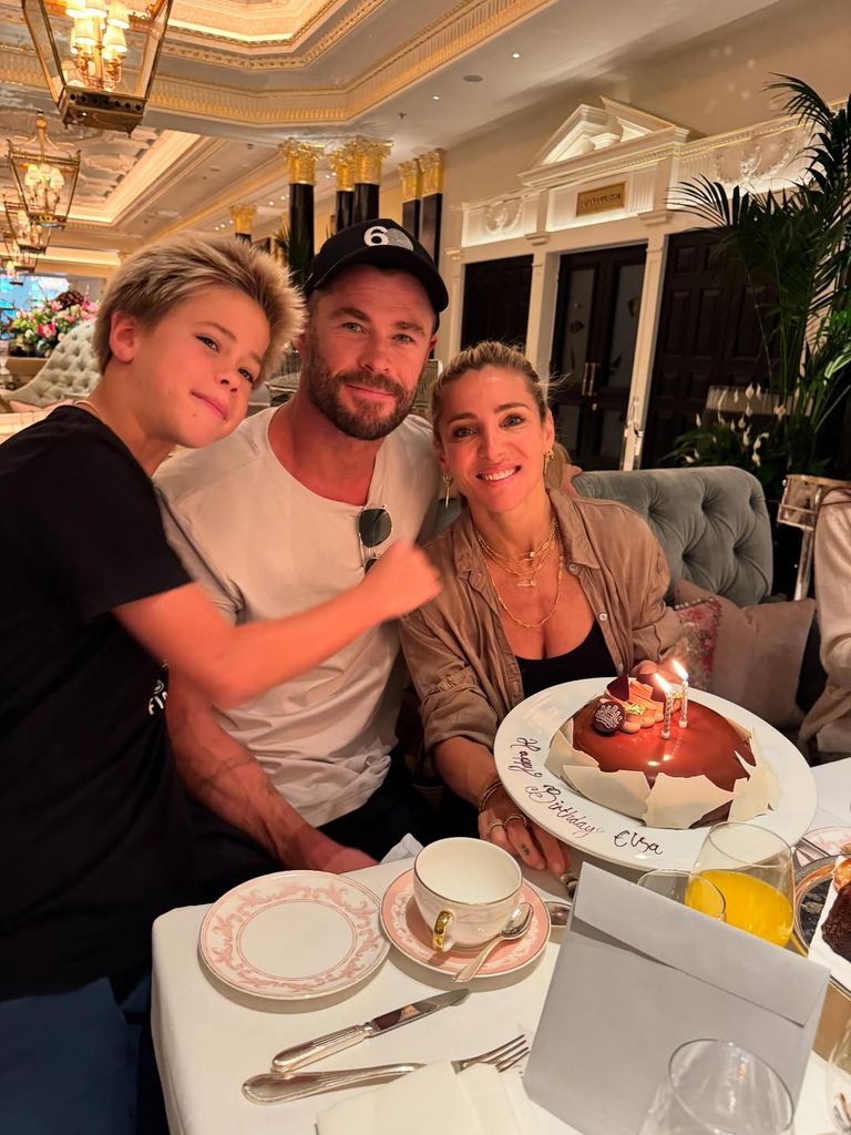 Chris, Elsa, and their son celebrating Elsa's birthday