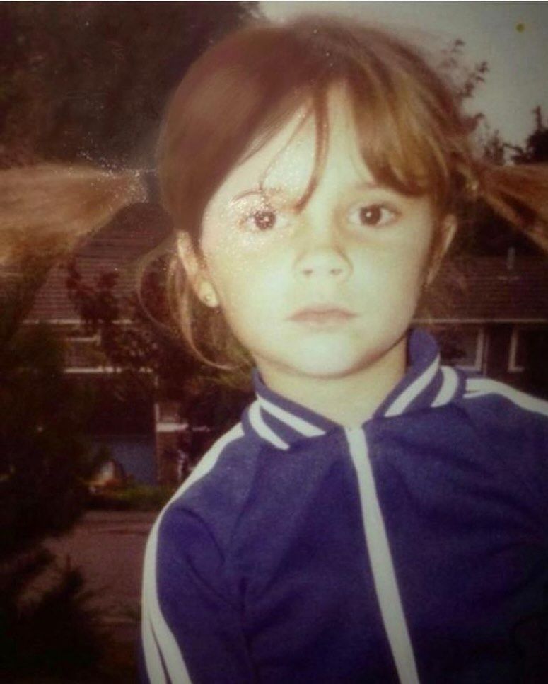 Victoria Beckham as a child with blue tracksuit