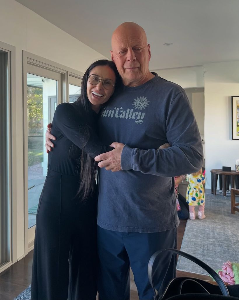 Demi Moore wraps her arms around her ex-husband, Bruce Willis