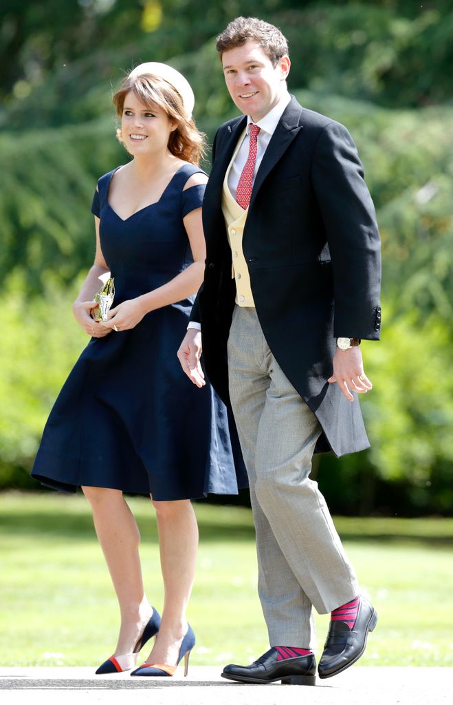 Princess Eugenie in a blue dress and heels with Jack Brooksbank in a tailcoat