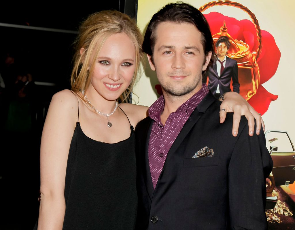 Juno Temple in a black dress with Michael Angarano in a black suit