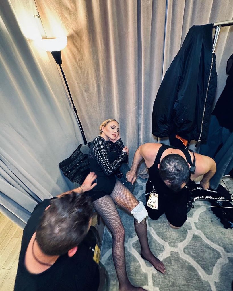 Madonna's team tends to her knee while rehearsing for "The Celebration Tour"