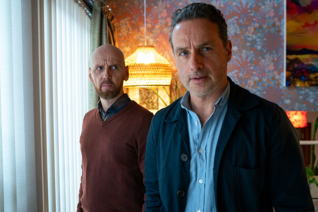 two men standing in living room