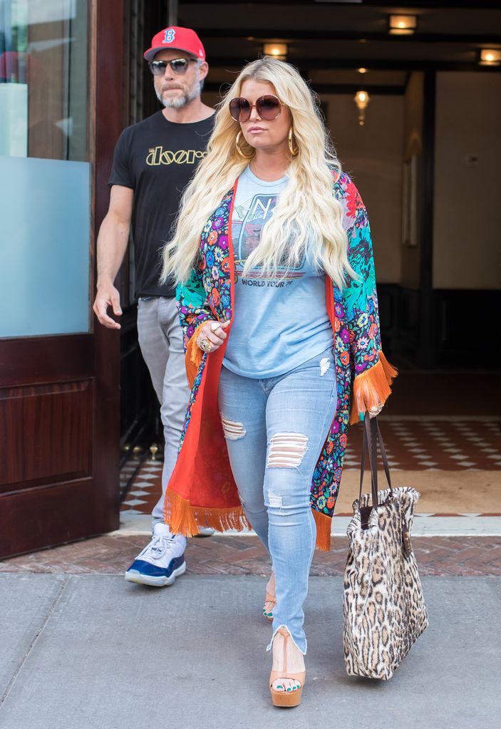 Jessica Simpson shows off her slender frame in skintight jeans as