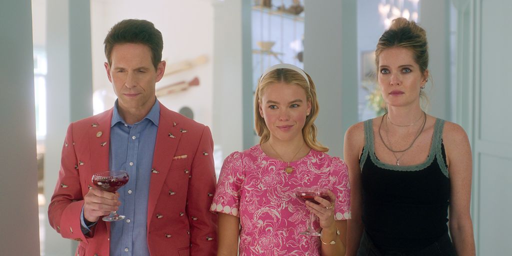 three people standing in house