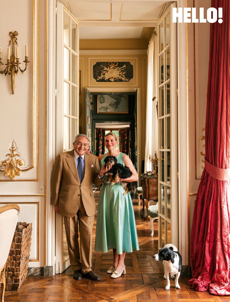 Anne with her father, Jean, and dogs, Miquette and Coco in one of the hallways of Château de Sourches