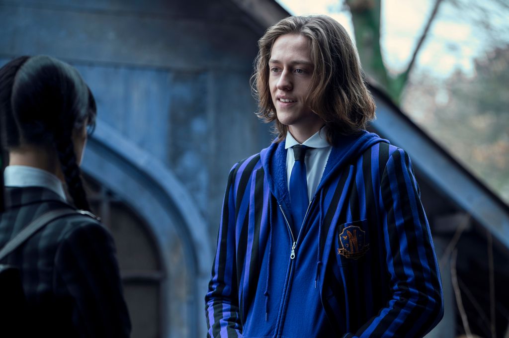 teenage boy with blonde hair in purple blazer