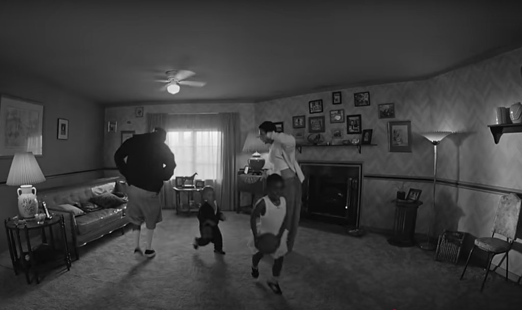 Kendrick Lamar and fiance Whitney dance around living room as their kids run past