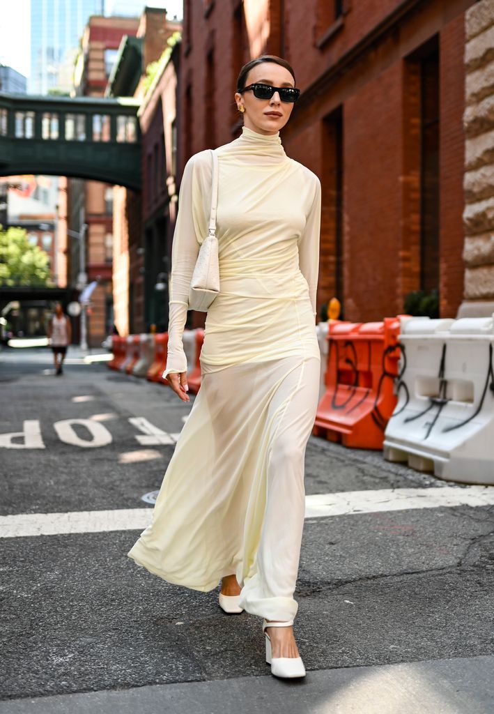 Mary Leest is seen wearing a cream Proenza Schouler dress, cream bag and black sungalsses outside the Proenza Schouler show on September 04, 2024 in New York City