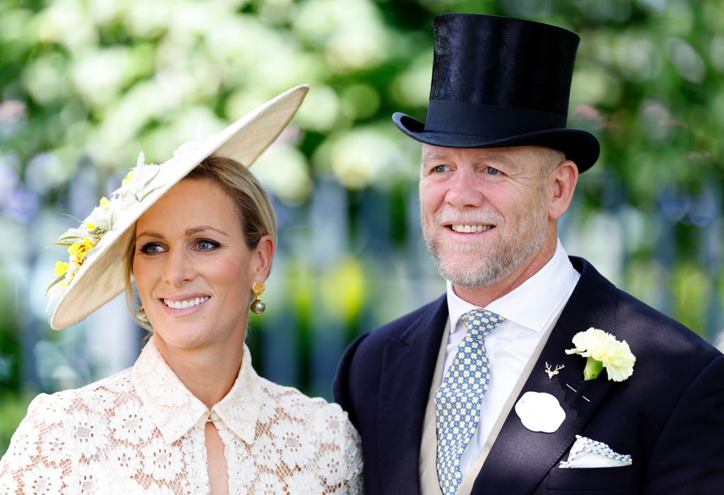 Zara Tindall in white and Mike Tindall in suit and top hat