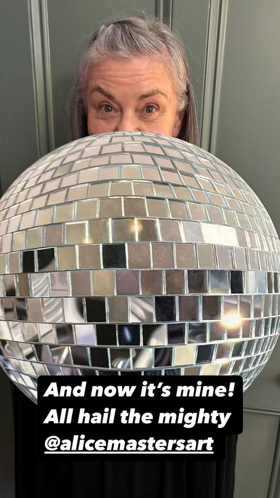 Dawn holding a discoball 