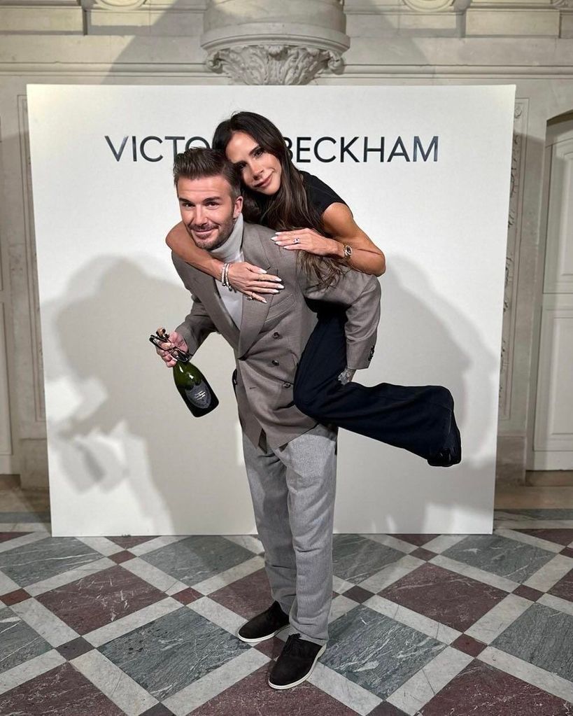 David Beckham giving his wife Victoria a piggy back