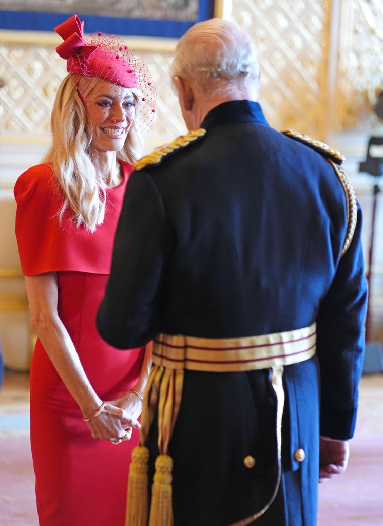 Tess received her award in a gorgeous red dress