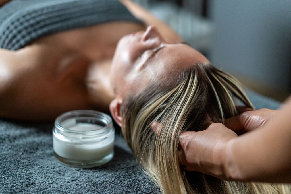 photo of woman having massage at spa