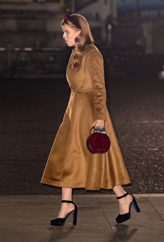 Princess Beatrice in velvet shoes and a tan coat