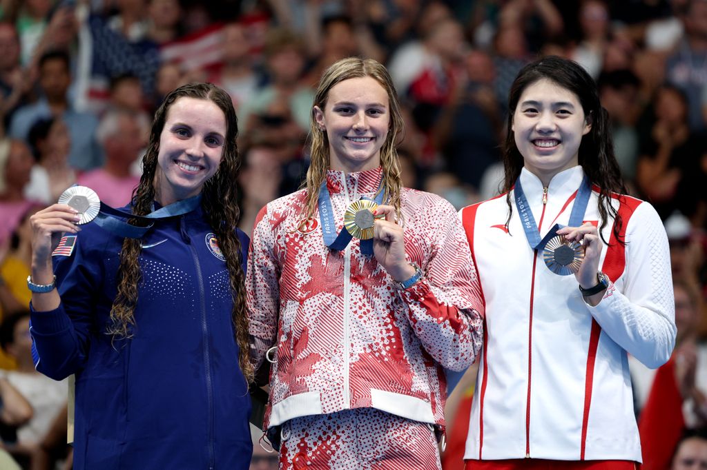 Gold Medalist Summer McIntosh of Team Canada (C), Silver Medalist Regan Smith of Team United States (L) and Bronze Medalist Zhang Yufei of Team People's Republic of China (R) 