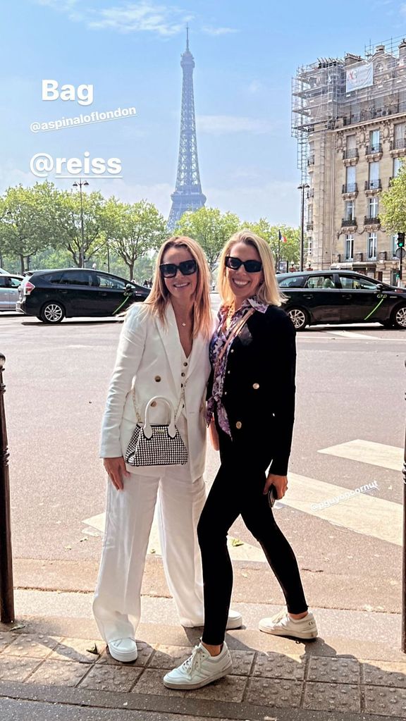 Amanda wearing a white suit in Paris