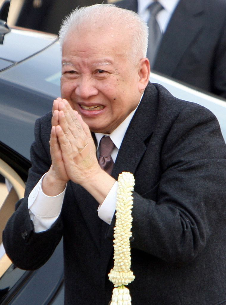 King Norodom Sihanouk with his hands together
