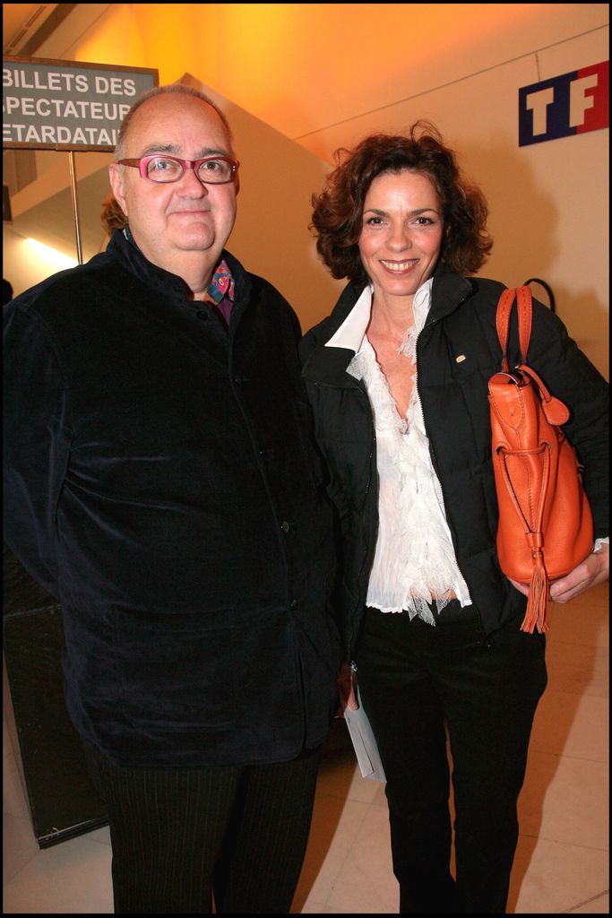 Elisabeth Bourgine in a white blouse and black blazer with her husband Jean Luc Miesch