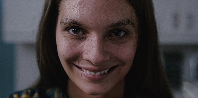 close-up of brunette woman smiling
