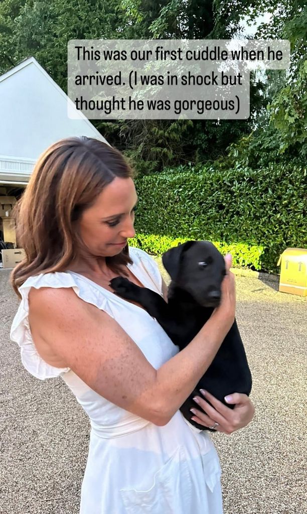 alex jones in white dress holding puppy scout 