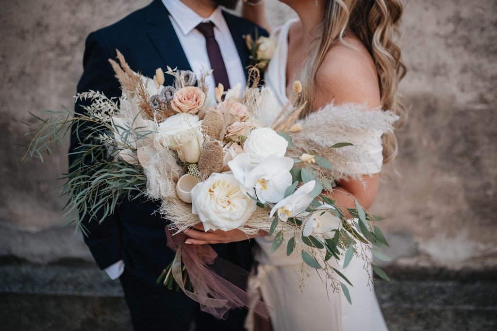 A bride and groom with a beautiful bouquet