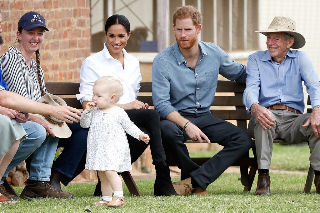 Harry and Meghan with a local farming family in Dubbo, Australia